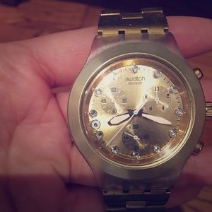 Gold Swatch watch